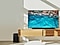 Soundbar dòng B và loa siêu trầm của Samsung được đặt cùng với TV Crystal UHD trên tủ phòng khách.
