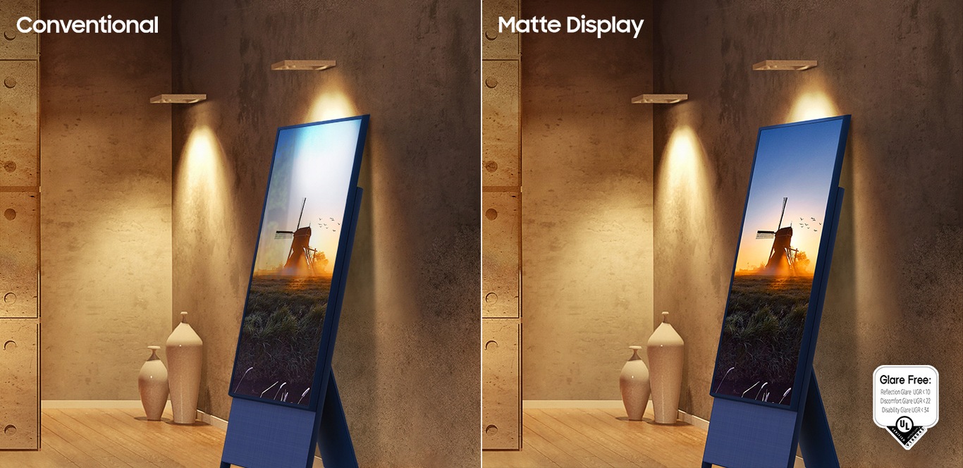 The Sero with conventional display has light reflections on its screen next to a lamp. The Sero with Matte Display has no glare even next to a lamp. The UL verified Glare Free logo is on display with Reflection Glare UGR<10, Discomfort Glare UGR<22, Disability Glare UGR<34.