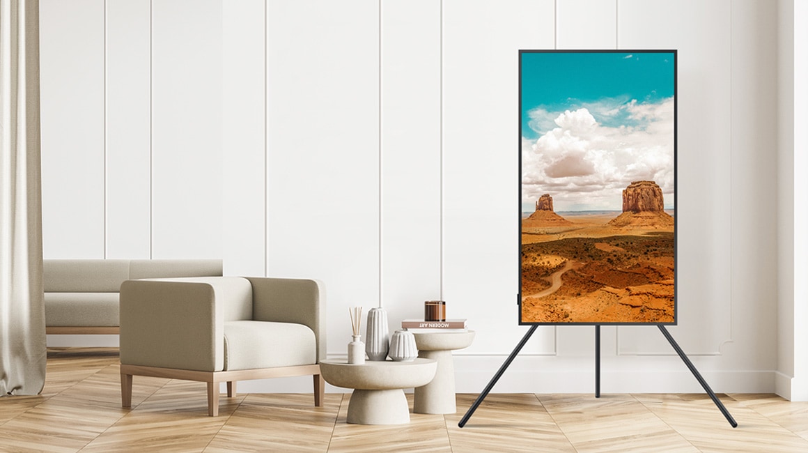 TV on Stand next to sofa.