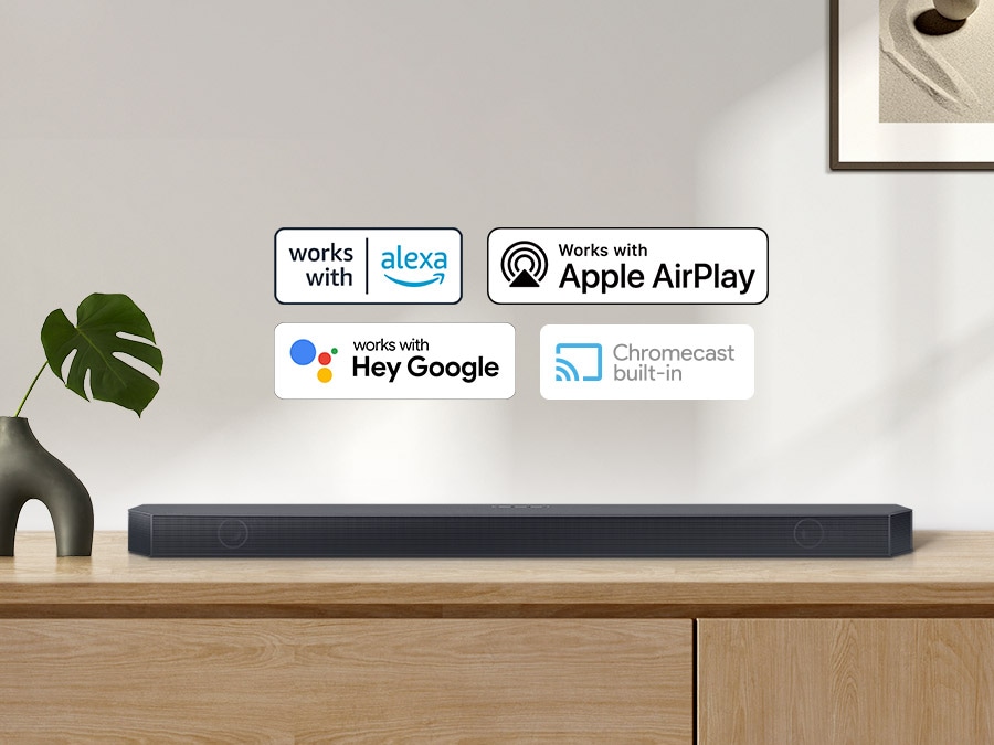 Chromecast built-in logo and Works with Alexa, Hey Google, and Apple AirPlay logos with a Samsung Q series Soundbar.