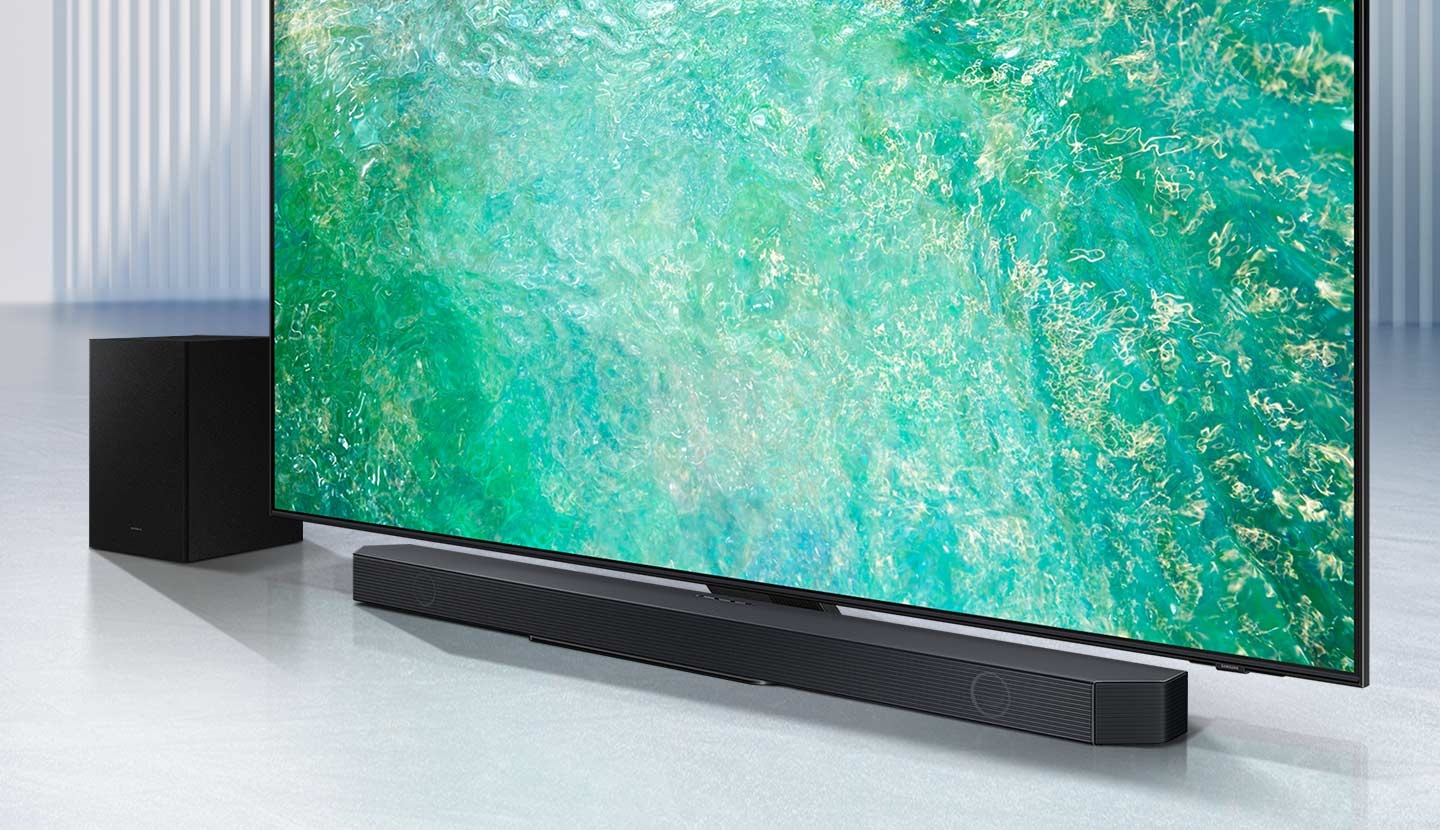 Samsung Q series Soundbar and subwoofer are positioned with QLED TV.