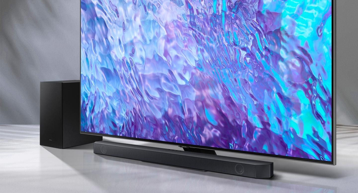 Samsung Q series Soundbar and subwoofer are positioned with QLED TV.