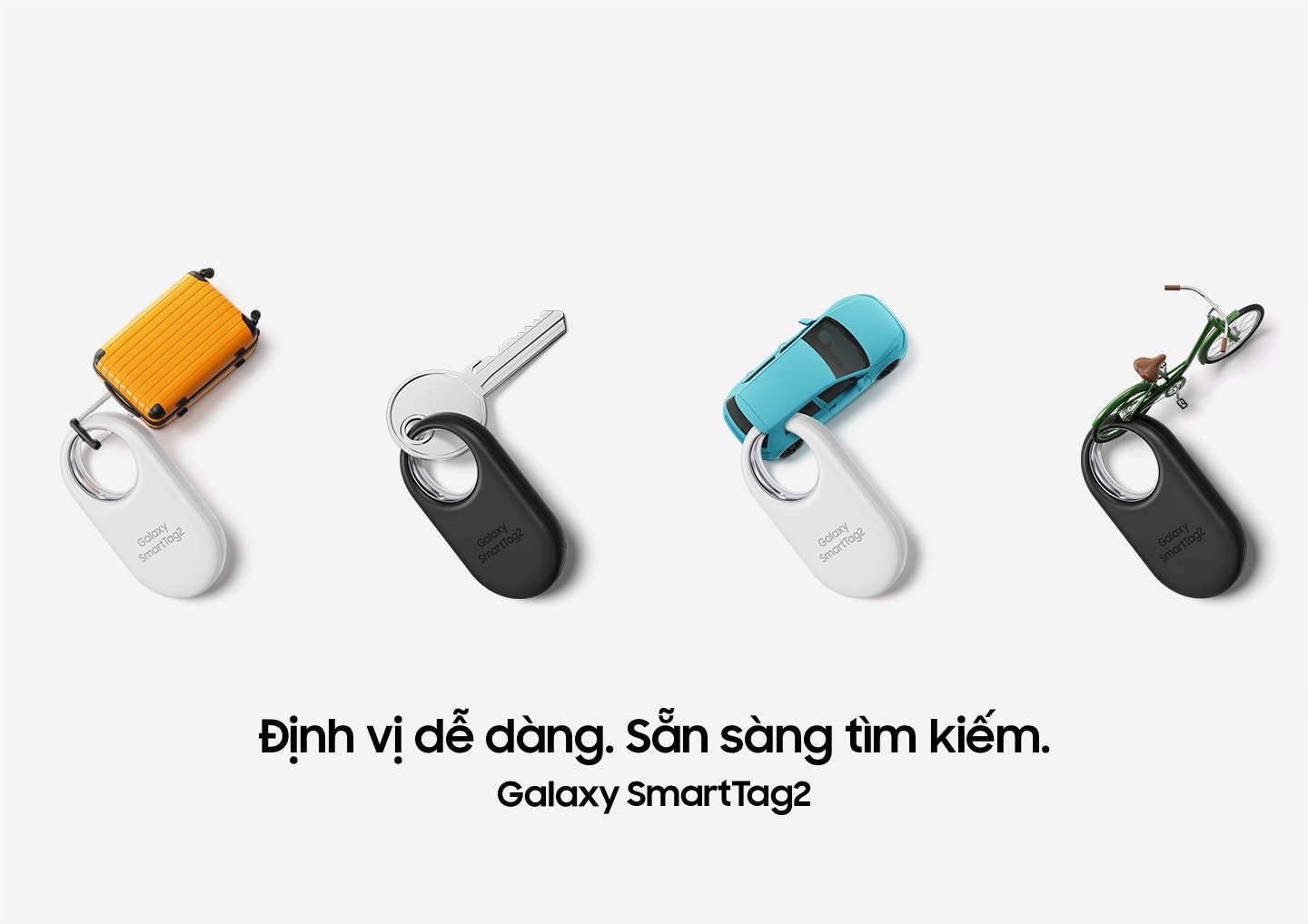  Bốn thiết bị Galaxy SmartTag2, hai chiếc màu trắng và hai chiếc màu đen, được đặt ngay ngắn. Các thiết bị này được gắn thẻ vào các mục sau: Một chiếc vali thu nhỏ, một chiếc chìa khóa, một chiếc ô tô thu nhỏ và một chiếc xe đạp thu nhỏ.
