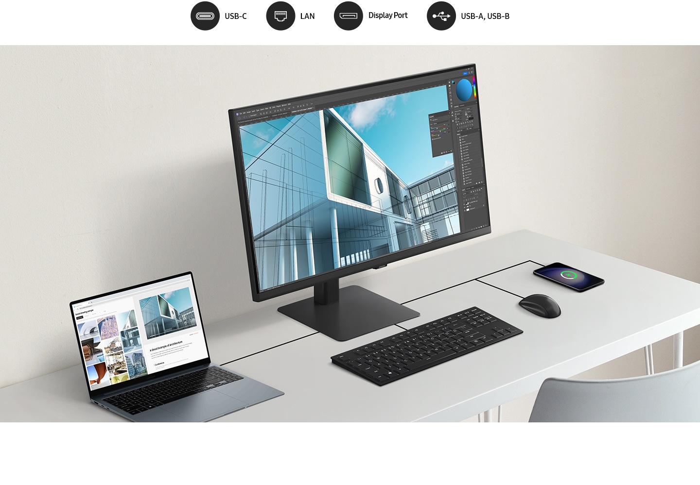 Máy tính xách tay, màn hình, bàn phím, chuột và điện thoại di động đều được kết nối trên bàn bằng dây. Phía trên màn hình có 4 biểu tượng là USB-C, LAN, Display Port, USB-A và USB-B.