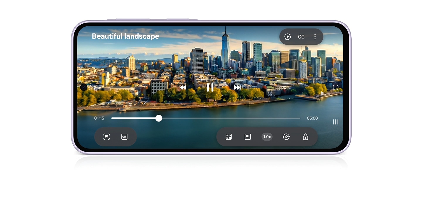 Một đoạn video đang phát trên Galaxy A37 5G ở chế độ xoay ngang với dòng chữ 'Cảnh sắc tuyệt mỹ' hiển thị trên màn hình. Thước phim mở ra một tầm nhìn bao quát toàn cảnh thành phố bên dòng sông, sau đó từ từ tiến gần vào những tòa nhà cao tầng san sát.