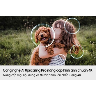 Image of a little girl kissing a puppy. The Samsung NQ4 AI Gen2 Processor appears on the photo and enhances several details, including the girl’s hair and clothes and the puppy’s face. The result is a much sharper image where subtle details are visible.