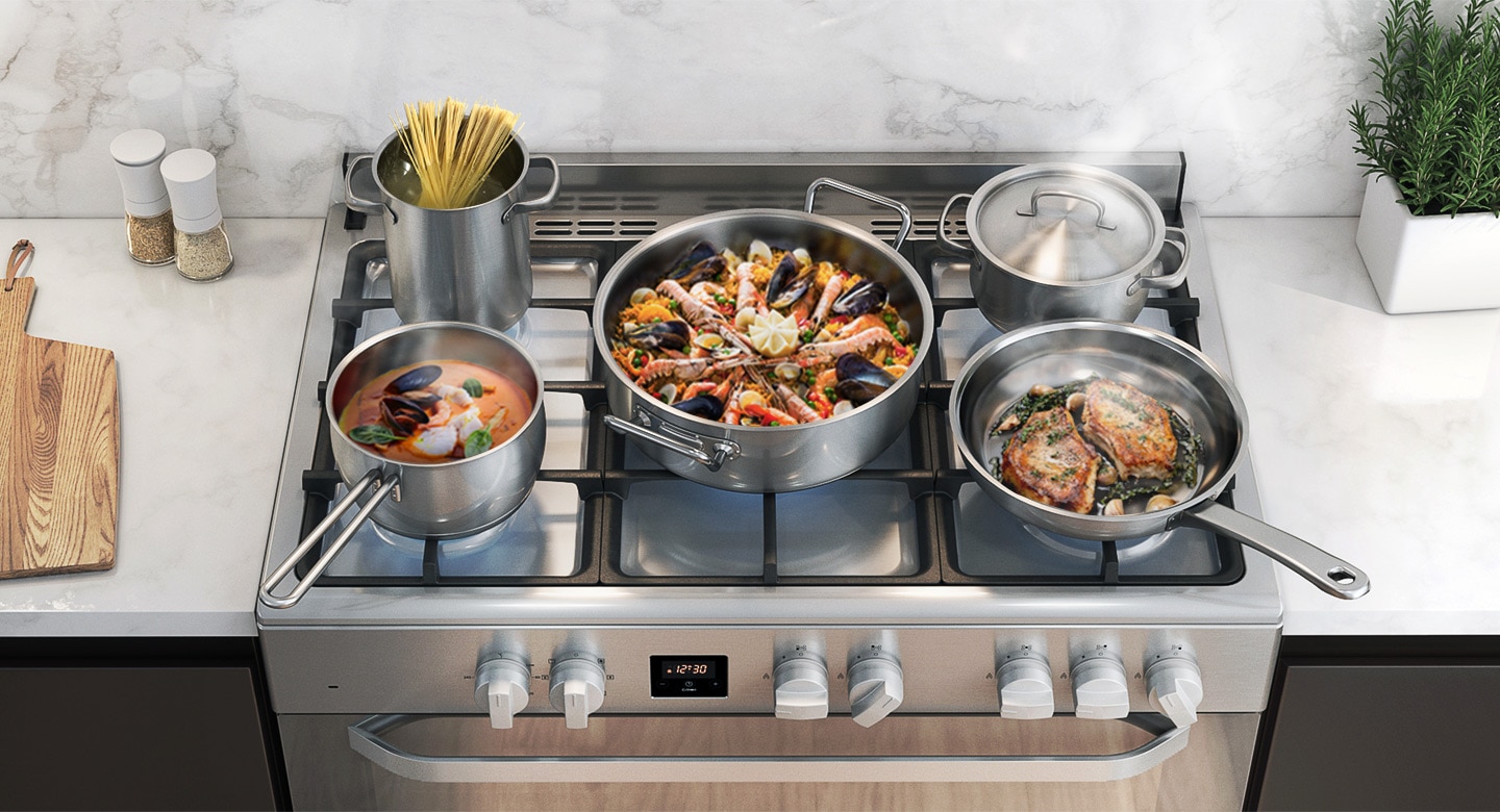 Various types of food (pasta noodles, paella, steak, etc.) are being cooked on the cooktop.