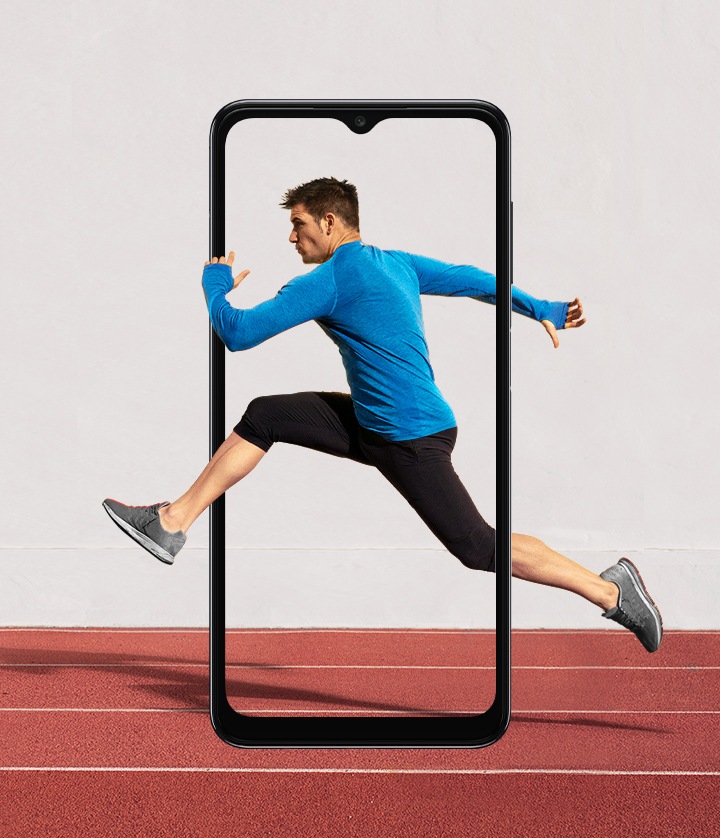 The outline of a Galaxy A04s display is set in portrait mode over a running track on a sports field. Onscreen is a man running, striding into the air with his hands and legs extending beyond the frame.
