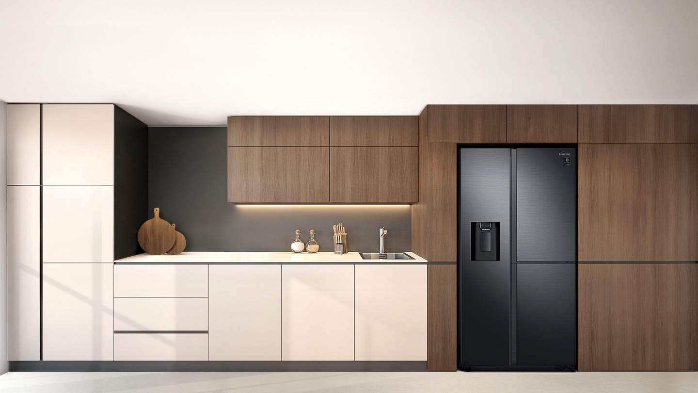 A 2-door refrigerator with a water dispenser is set in a stylish kitchen, placed flush with dark wood paneling.