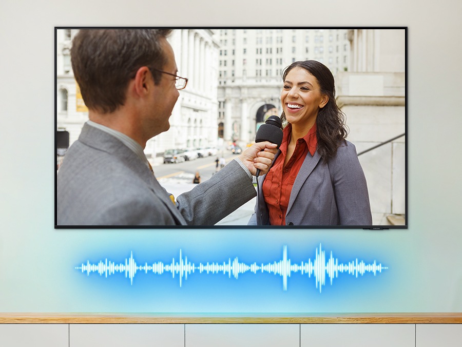 Soundwaves beneath the TV change in shape as the TV sound adapts to the news, orchestra and basketball game being displayed.