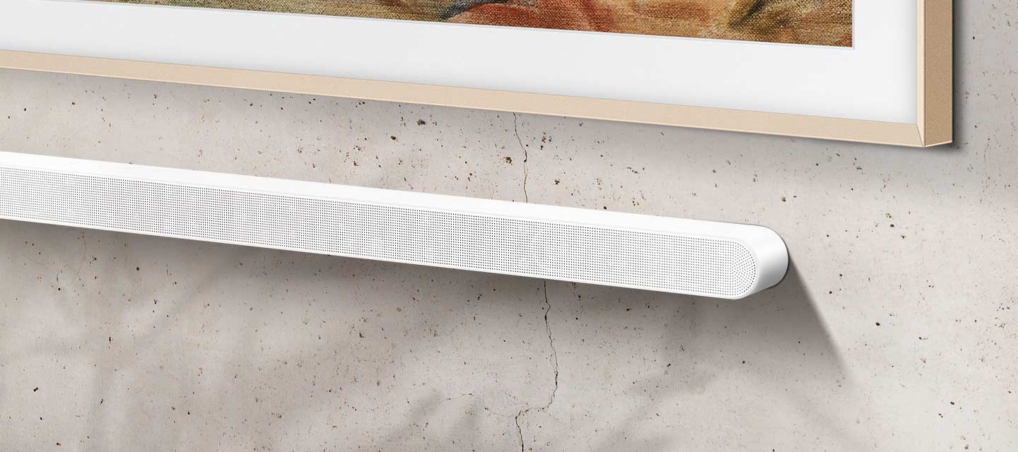 A bulky Soundbar is installed on the wall, underneath a TV. The bulky Soundbar fades away and is replaced by an Ultra Slim Soundbar, which takes up less space.