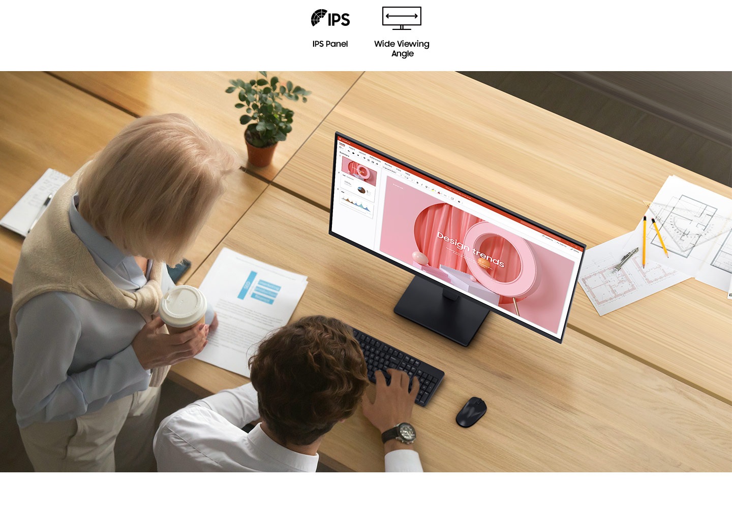 There are two people looking at a document on the Essential Monitor S3. And there are IPS and Wide Viewing Angle icons above them.