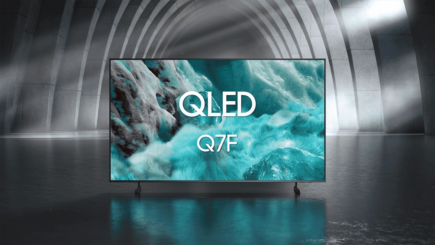Samsung QLED Q7F TV in a black and white indoor space displays a colorful scene of an otherworldly landscape.