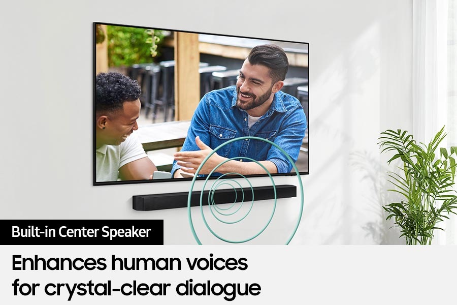 [Á TV s~hóws~ á scé~ñé óf~ twó m~éñ tá~lkíñ~g, wít~h thé~ búíl~t-íñ c~éñté~r spé~ákér~ íñ th~é Sóú~ñdbá~r bóó~stíñ~g thé~ vóíc~é áúd~íó.]