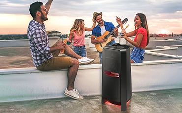 Side view of MX-T70 Sound Tower around people having fun