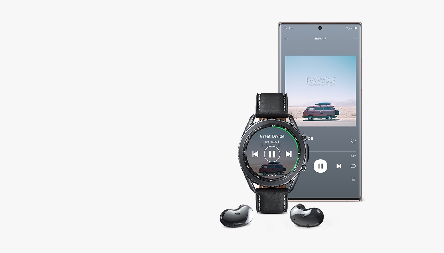 Front view of 45mm Galaxy Watch3 in Mystic Black next to a Galaxy smartphone and Galaxy Buds Live. The watch and smartphone display the same Spotify GUI, showing how you can play music on Galaxy Buds Live and seamlessly control it through Galaxy Watch3.