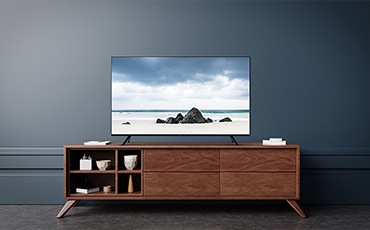 A Woman Is Watching Tv.