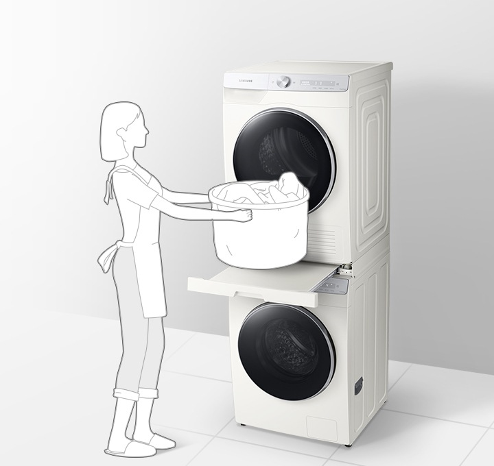 [이미지 중앙부에 화이트 색상 세탁기/건조기가 직렬 설치되어 있고 세탁기/건조기 중앙의 설치 키트 서랍이 열려있습니다. 제품 왼쪽에는 단발 여자가 빨래바구니를 서랍에 올려놓는 동작을 하는 일러스트가 그려져 있습니다. 우측에는 원 안에 설치 키트 서랍이 열린채로 확대되어 있고 파란색 화살표로 서랍이 열리는 방향을 나타내고 있습니다.]