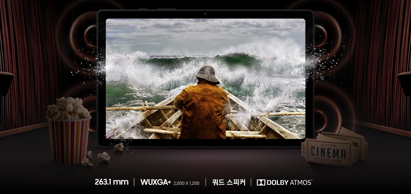 제품의 4방향 스피커에서 소리가 나는 듯한 표현이 되어있고  화면에는 한 남성이 배를 타고 바다를 가르는 장면이 노출되어있습니다. 사진 밑에는 263.1 mm, WUXGA+ (2,000 * 1200), 쿼드 스피커, DOLBY ATMOS 기능이 표기되어 있습니다.