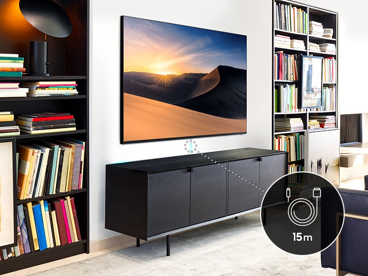 거실에 TV가 벽에 설치되어 있고 매직케이블을 확대하여 아이콘으로 보여주고 있습니다.