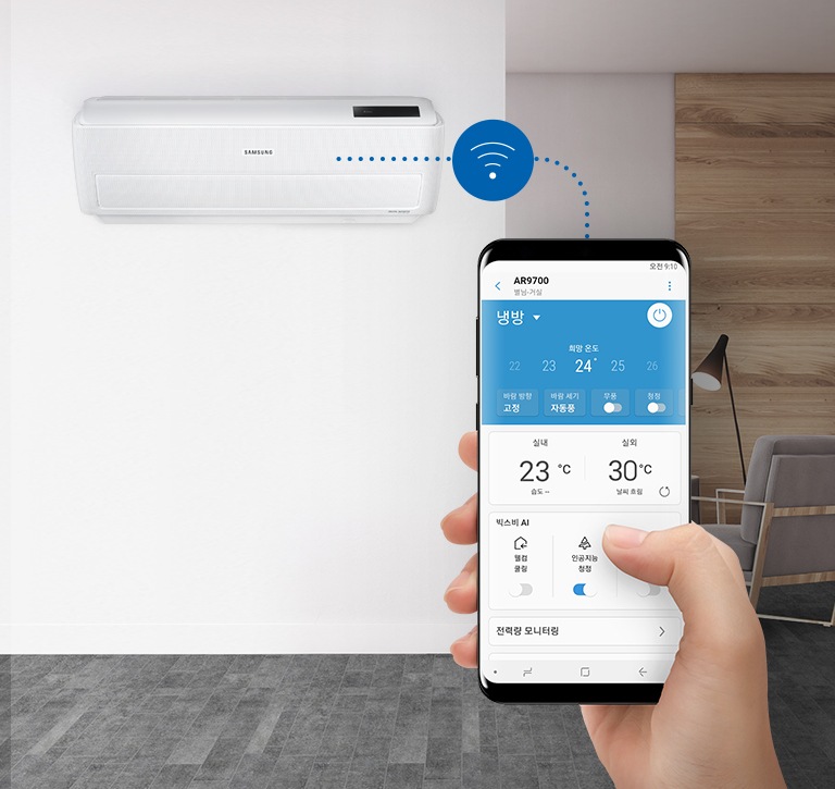 스마트폰으로 에어컨을 작동하는 화면이 연출되고 있습니다.