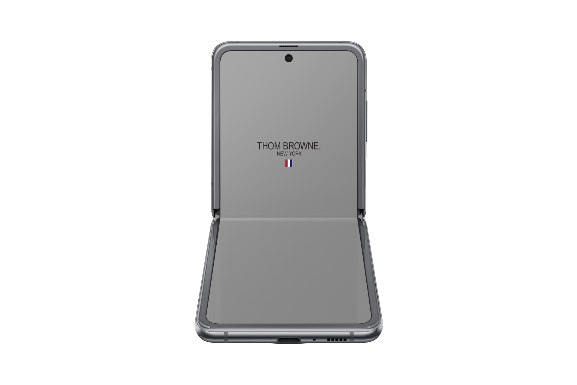 A front-table-top view of Samsung Galaxy Z Flip Thom Browne Singapore in Grey SM-F700FZAZXSP) shows a Thom Browne logo