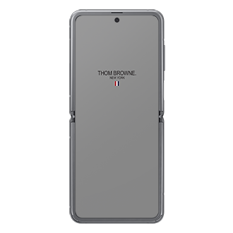 The open-front of Samsung Galaxy Z Flip Thom Browne Singapore Edition in Grey (SM-F700FZAZXSP) shows a Thom Browne logo on the screen