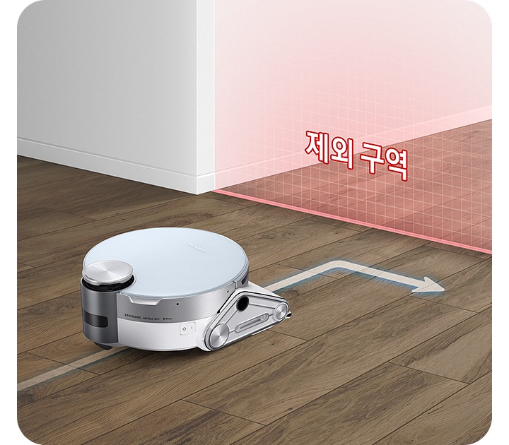 바닥을 청소하고 있는 제트 봇 앞에 가상 벽을 연출한 붉은색의 반투명한 벽이 있습니다. 벽에는 제한 구역이라는 텍스트가 보여지며 제트 봇이 해당 영역에 접근하지 않고 방향을 바꾸는 화살표 표시도 함께 있습니다.