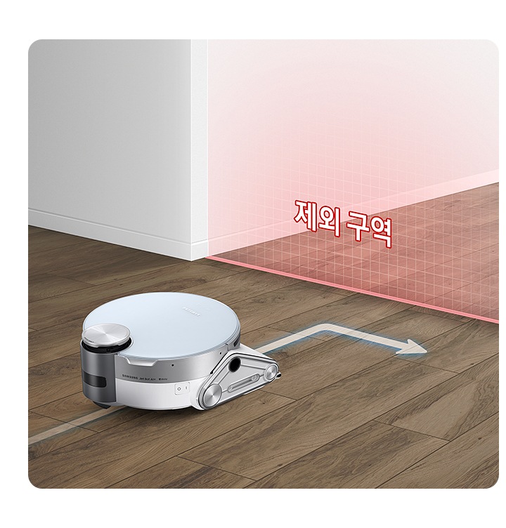 바닥을 청소하고 있는 제트 봇 앞에 가상 벽을 연출한 붉은색의 반투명한 벽이 있습니다. 벽에는 제한 구역이라는 텍스트가 보여지며 제트 봇이 해당 영역에 접근하지 않고 방향을 바꾸는 화살표 표시도 함께 있습니다.