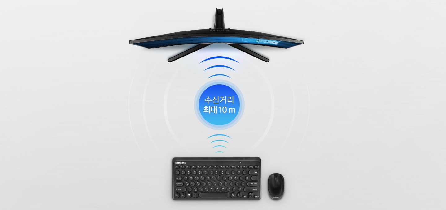 키보드와 마우스가 놓여있고 수신거리 최대 10 M 문구와 함께 모니터가 보입니다.