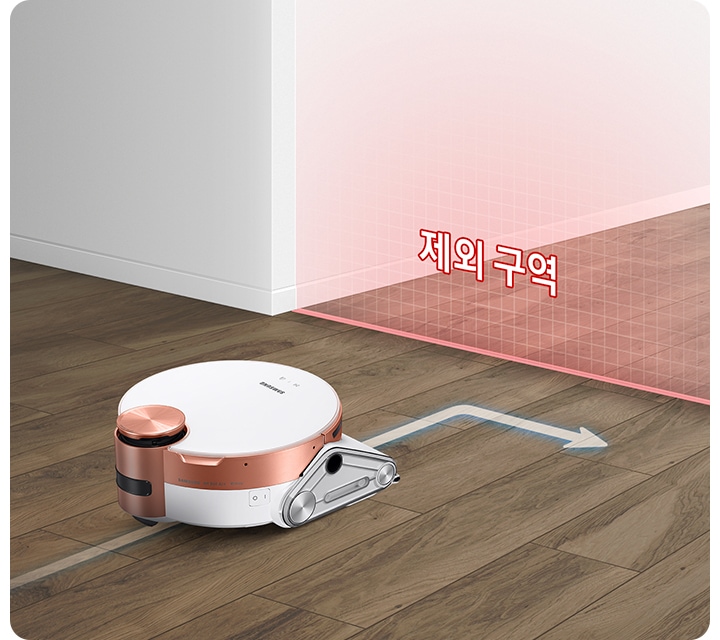 바닥을 청소하고 있는 제트 봇 앞에 가상 벽을 연출한 붉은색의 반투명한 벽이 있습니다. 벽에는 제한 구역이라는 텍스트가 보여지며 제트 봇이 해당 영역에 접근하지 않고 방향을 바꾸는 화살표 표시도 함께 있습니다.