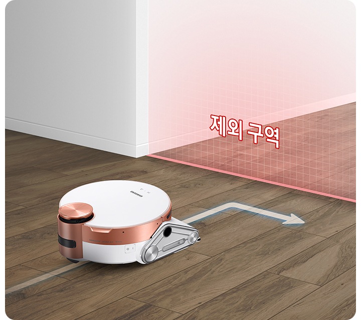 바닥을 청소하고 있는 제트 봇 앞에 가상 벽을 연출한 붉은색의 반투명한 벽이 있습니다. 벽에는 제한 구역이라는 텍스트가 보여지며 제트 봇이 해당 영역에 접근하지 않고 방향을 바꾸는 화살표 표시도 함께 있습니다.