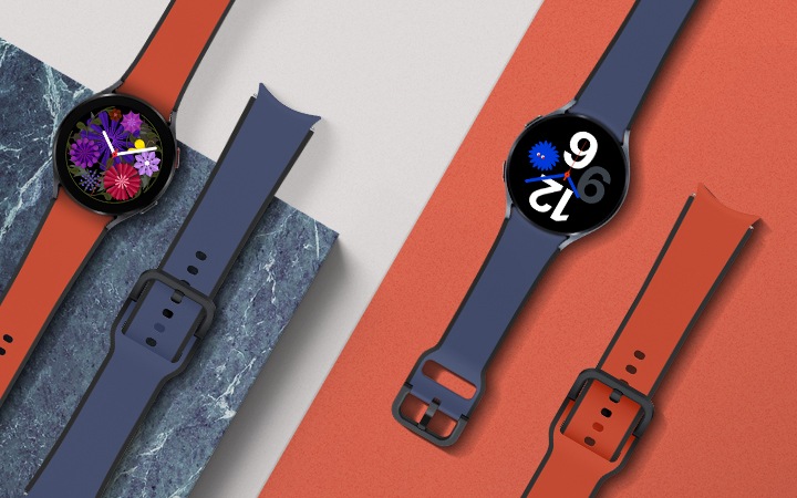 베이지, 레드 컬러가 배경색이고, 네이비와 레드 컬러의 투톤 스포츠 스트랩에 워치가 장착된 채로 나열 되어 있습니다.