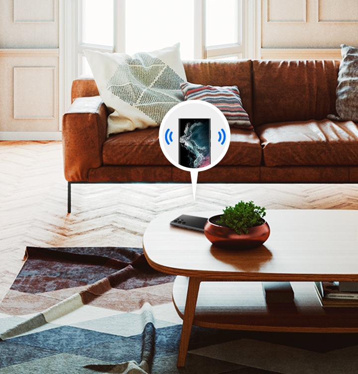 테이블 위에 스마트폰이 놓여져있고, 스마트폰이 울리는 듯한 아이콘이 스마트폰 양 옆에 그려져있습니다.