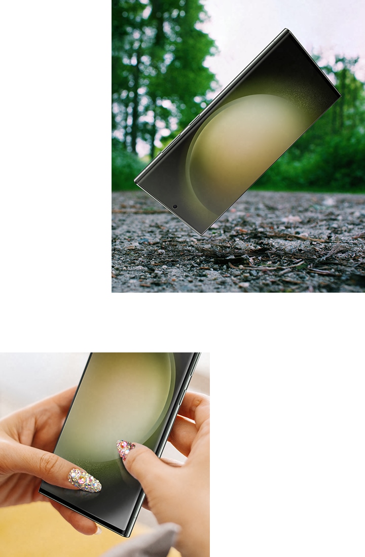 스크린 프로텍터가 부착된 갤럭시 S23 Ultra 기기가 거친 표면 위에 놓여 있습니다. 스크린 프로텍터의 긁힘 방지 코팅을 강조하기 위해 양 손의 손톱으로 스마트폰 화면을 긁고 있습니다. 