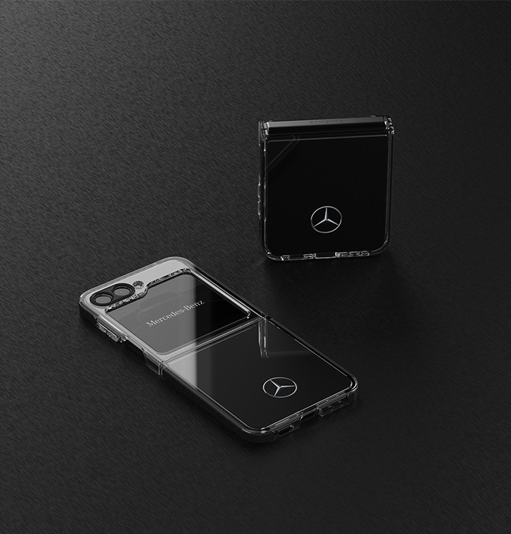 Two Galaxy Z Flip 5 Mercedes Benz cases are shown mounted on a black background. The upper Galaxy Z Flip 5 is folded and standing upright, while the lower Galaxy Z Flip 5 is unfolded and shown facing the camera.