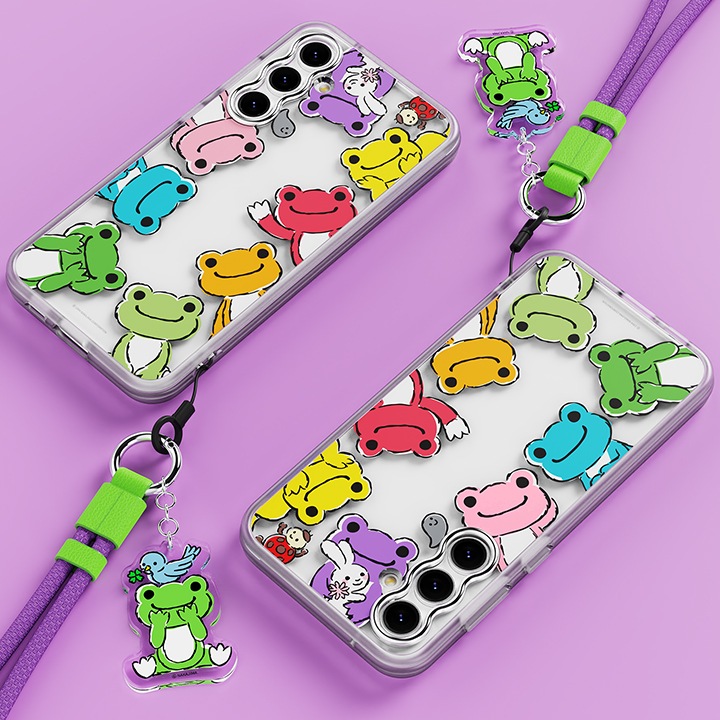 보라색 배경에 이미지 왼쪽 상단 부분에는 갤럭시 S23 FE pickles the frog 버라이어티 케이스 (퍼플)을 장착한 후 오른쪽으로 40도 기울여 눕힌 이미지 오른쪽  하단 부분에 키링을 장착한 이미지가 있고 이미지 오른쪽 하단 부분에는 갤럭시 S23 FE pickles the frog 버라이어티 케이스 (퍼플)을 장착한 후 왼쪽으로 130도 돌아간 후 눕힌 정면 이미지가 배치하여 있습니다.