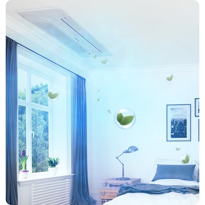 방 안으로 보여지는 공간에 좌측엔 창이 있으며 창밖엔 나무가 보여집니다 창 양쪽엔 그레이 톤의 커튼이 있고 가운데인 희색의 침대가 보여집니다. 침대위에는 두개의 흰색 배개와 그레이톤의 쿠션 2개가 보여지고 침대 헤드 위 벽에는 풍경 사진 액자 3개가 보여집니다. 우측엔 실버색상의 케리어가 보이고 그옆에 알록달록의 서랍이 보여집니다. 창가쪽 천장에 1way 천장형 시스템에어컨이 보여지며 바람문이 닫히고 무풍으로 작동 하는 듯한 형상을 하고 있습니다