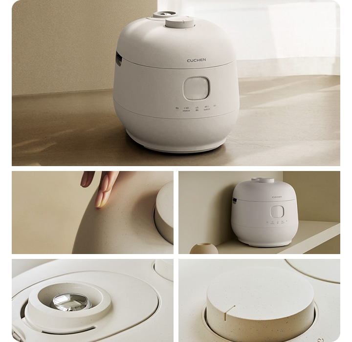 좌측에는 브라운톤 배경에 쿠첸 밥솥 이미지 크게 하나 있습니다. 우측에는 쿠첸 밥솥 각도별로 총 4개의 이미지가 있습니다. 첫번째 이미지는 사람손이 밥솥 만지고 있는 이미지입니다. 두번째 이미지는 공간에 놓여진 밥솥 이미지가 있습니다. 세번째 이미지는 압력밸트 확대된 이미지입니다. 네번째 이미지는 핸들부분 확대된 이미지입니다.