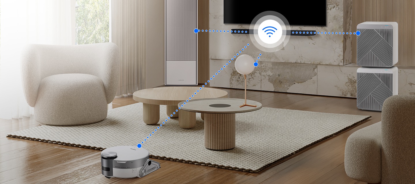 거실 벽면에 TV와 사운드바가 설치되어 있습니다. 사운드바와 집안의 다양한 가전제품들이 와이파이 또는 무선 네트워크에 연결되어 있는 모습이 보입니다.