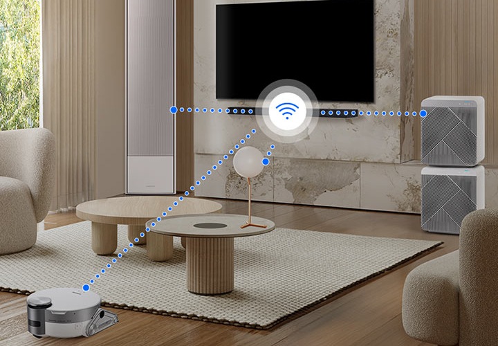 거실 벽면에 TV와 사운드바가 설치되어 있습니다. 사운드바와 집안의 다양한 가전제품들이 와이파이 또는 무선 네트워크에 연결되어 있는 모습이 보입니다.