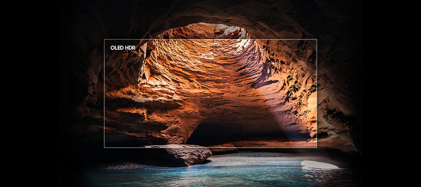 TV 정면이 보이며, 화면에는 계곡과 동굴이 보입니다.