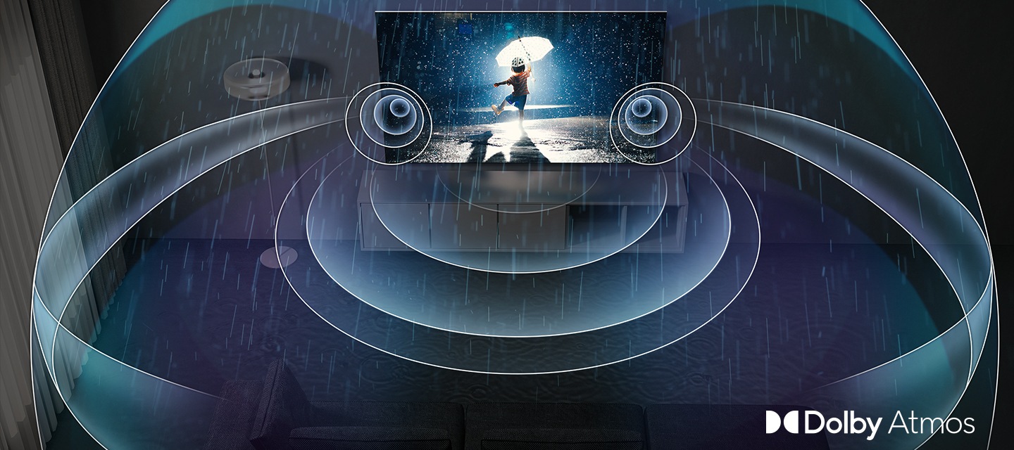 벽걸이 TV가 설치되어 있고, TV에서 나오는 음파들이 합성되어 있습니다. 우측 하단에는 돌비 앳모스 아이콘이 합성되어 있습니다.