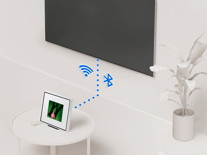 뮤직 프레임과 TV가 연결되어 있습니다. 연결선 양옆으로 Wi-Fi와 블루투스 아이콘이 있습니다.