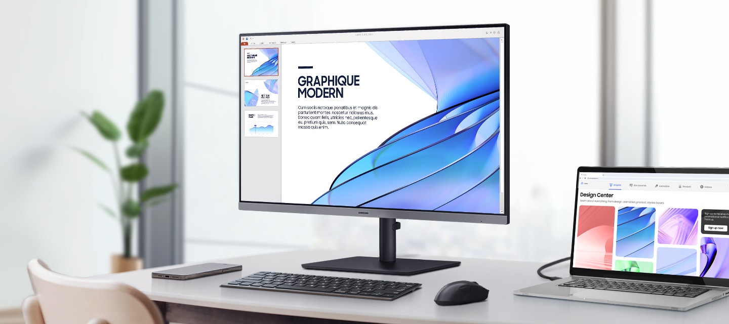 책상 위에 모니터가 보입니다.