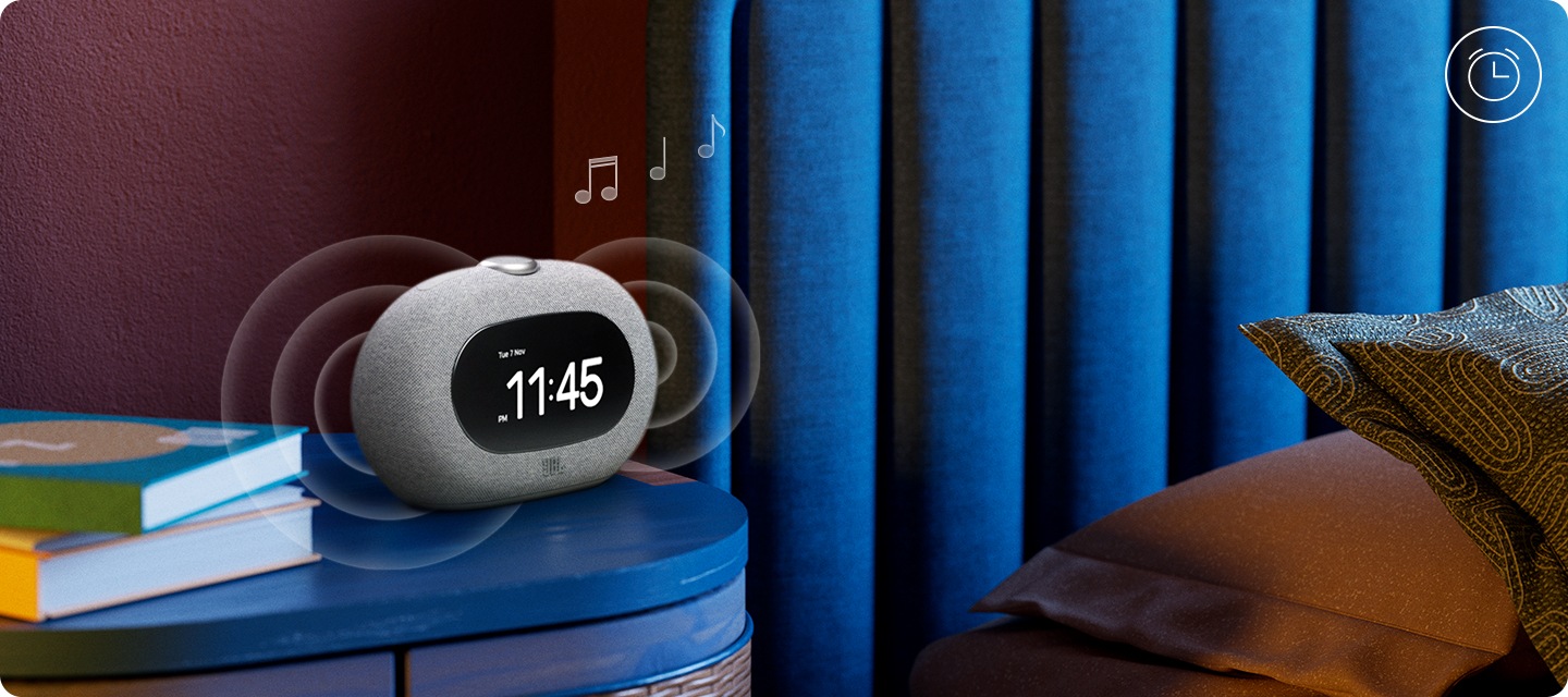 침대 옆 테이블 위에 HORIZON 3가 놓여 있습니다. HORIZON 3에서 음향효과가 나오고 있습니다.