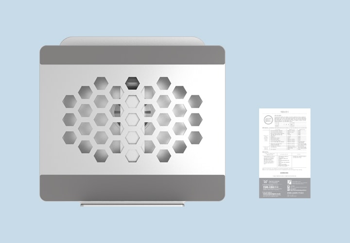 노트북 거치대의 상단 모습이 보이고 오른쪽엔 제품 보증서가 보입니다.