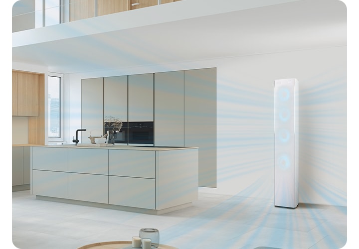 다이닝과 주방으로 보여지는 전경에 우측에 스탠드 에어컨이 작동되어 시원한게 바람이 나오는듯한 형상을 하고있고 에어컨 전면부의 서큘팬을 형상화 하는 듯한 하늘색의 원형이 이 바람모양 형상을 하듯 있습니다.