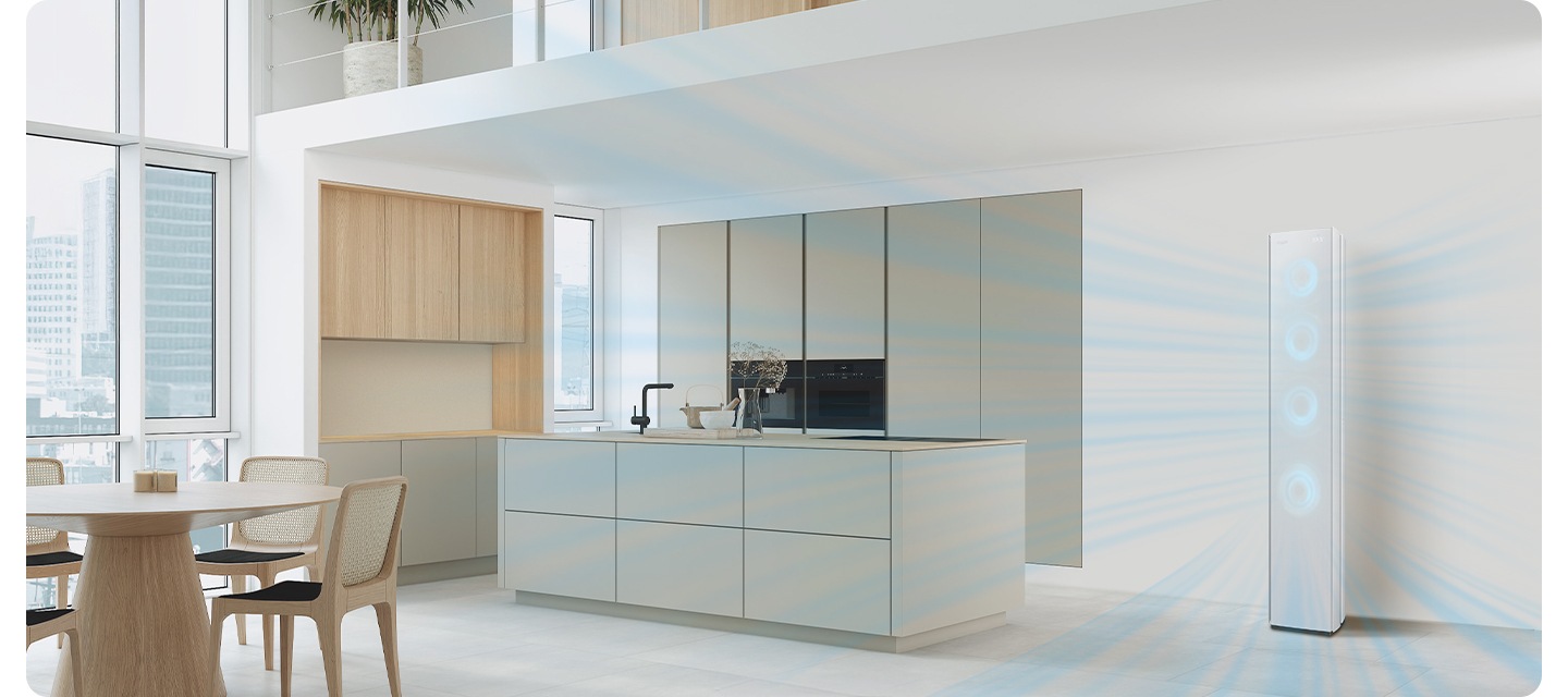 다이닝과 주방으로 보여지는 전경에 우측에 스탠드 에어컨이 작동되어 시원한게 바람이 나오는듯한 형상을 하고있고 에어컨 전면부의 서큘팬을 형상화 하는 듯한 하늘색의 원형이 이 바람모양 형상을 하듯 있습니다.