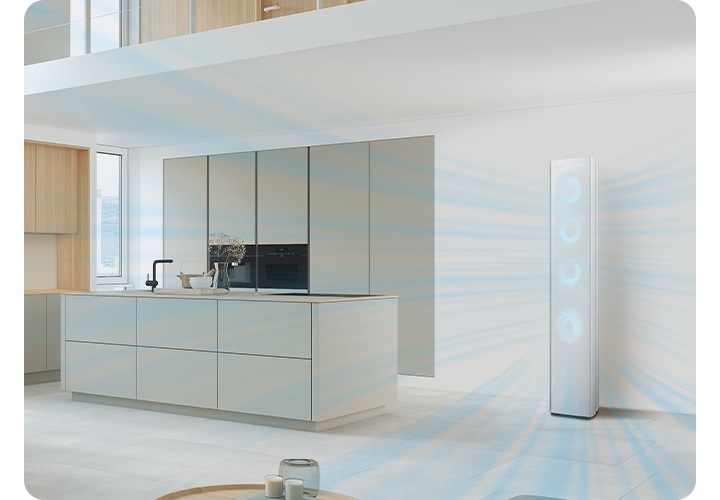 다이닝과 주방으로 보여지는 전경에 우측에 스탠드 에어컨이 작동되어 시원한게 바람이 나오는듯한 형상을 하고있고 에어컨 전면부의 서큘팬을 형상화 하는 듯한 하늘색의 원형이 이 바람모양 형상을 하듯 있습니다.